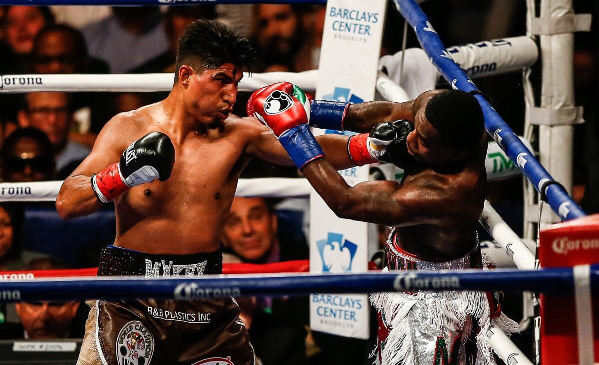 Mikey Garcia, left, and Adrien Broner exchange punches during a bout in 2017 at the Barclays Center in Brooklyn.