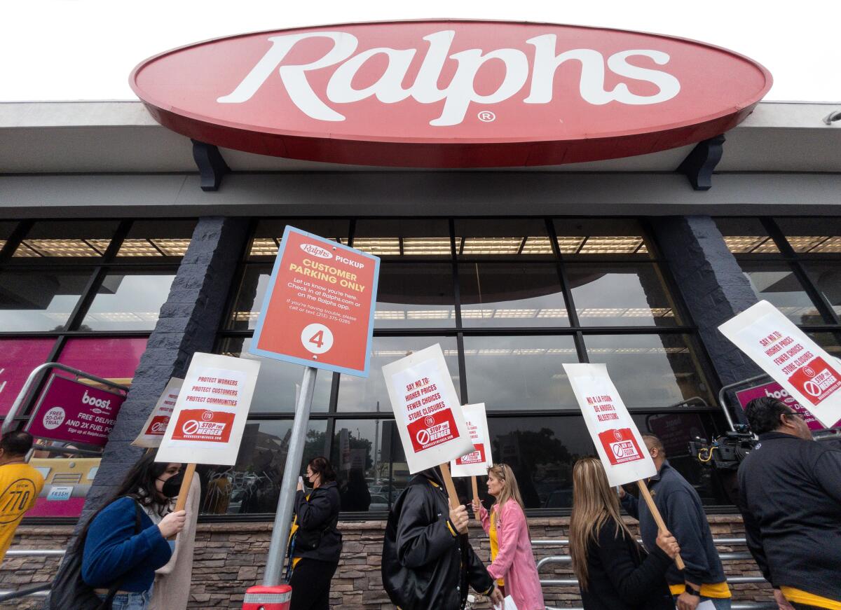 Grocery workers rally in front of a Ralphs supermarket