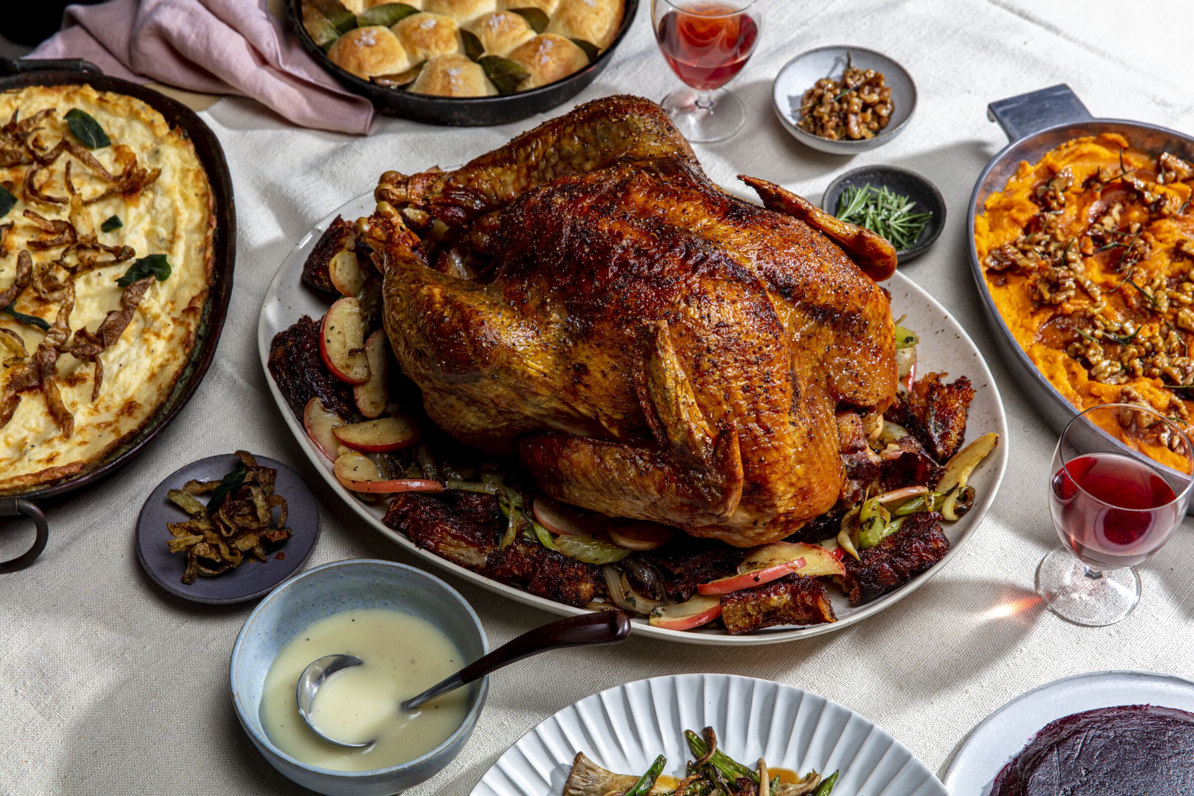 Thanksgiving dinner spread with turkey at center