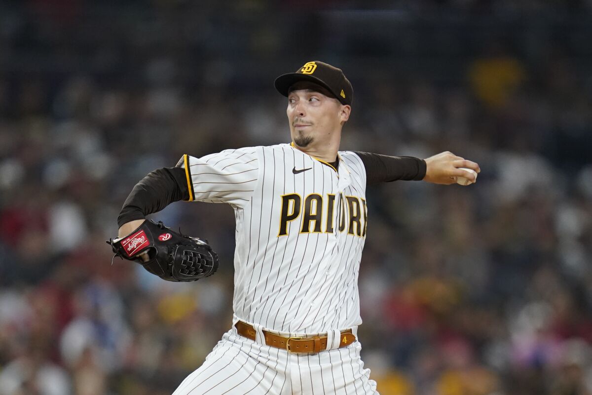 San Diego Padres starting pitcher Blake Snell works against a Los Angeles Angels batter during the first inning of a baseball game Tuesday, Sept. 7, 2021, in San Diego. (AP Photo/Gregory Bull)