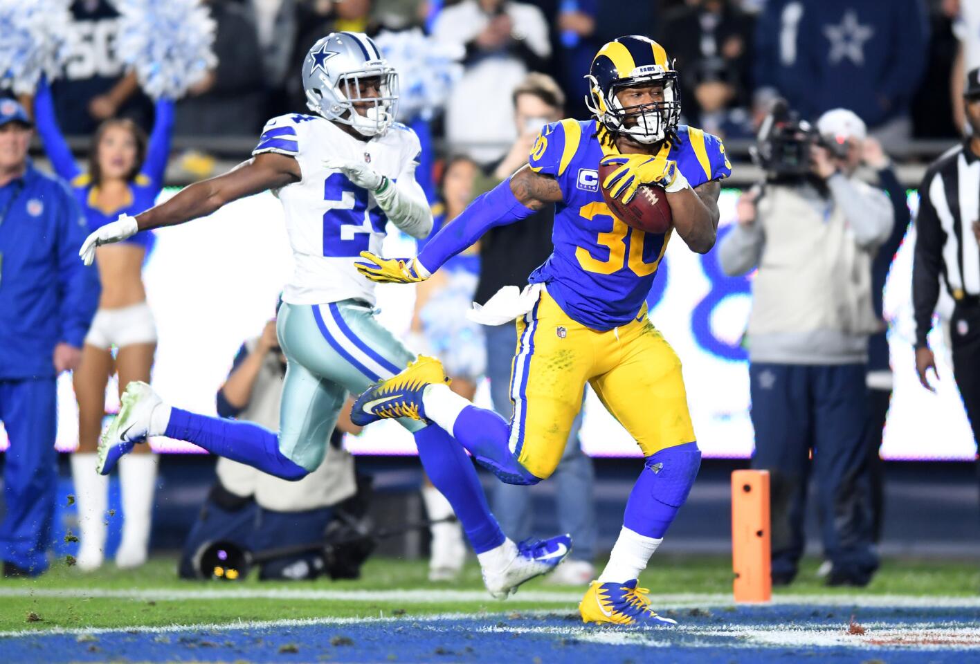 Rams running back Todd Gurley beats Cowbows cornerback Chidobe Awuzie to finish off his scoring run during the second quarter.