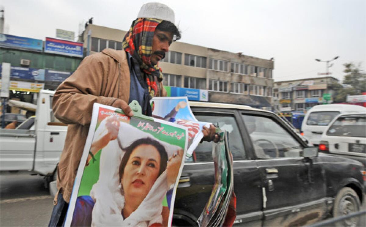 REMEMBERING BHUTTO: Vendor in Rawalpindi sells posters of slain Pakistani politician Benazir Bhutto. The government blames Baitullah Mahsud for her December assassination, but he denies involvement. Some analysts see him as a figurehead.
