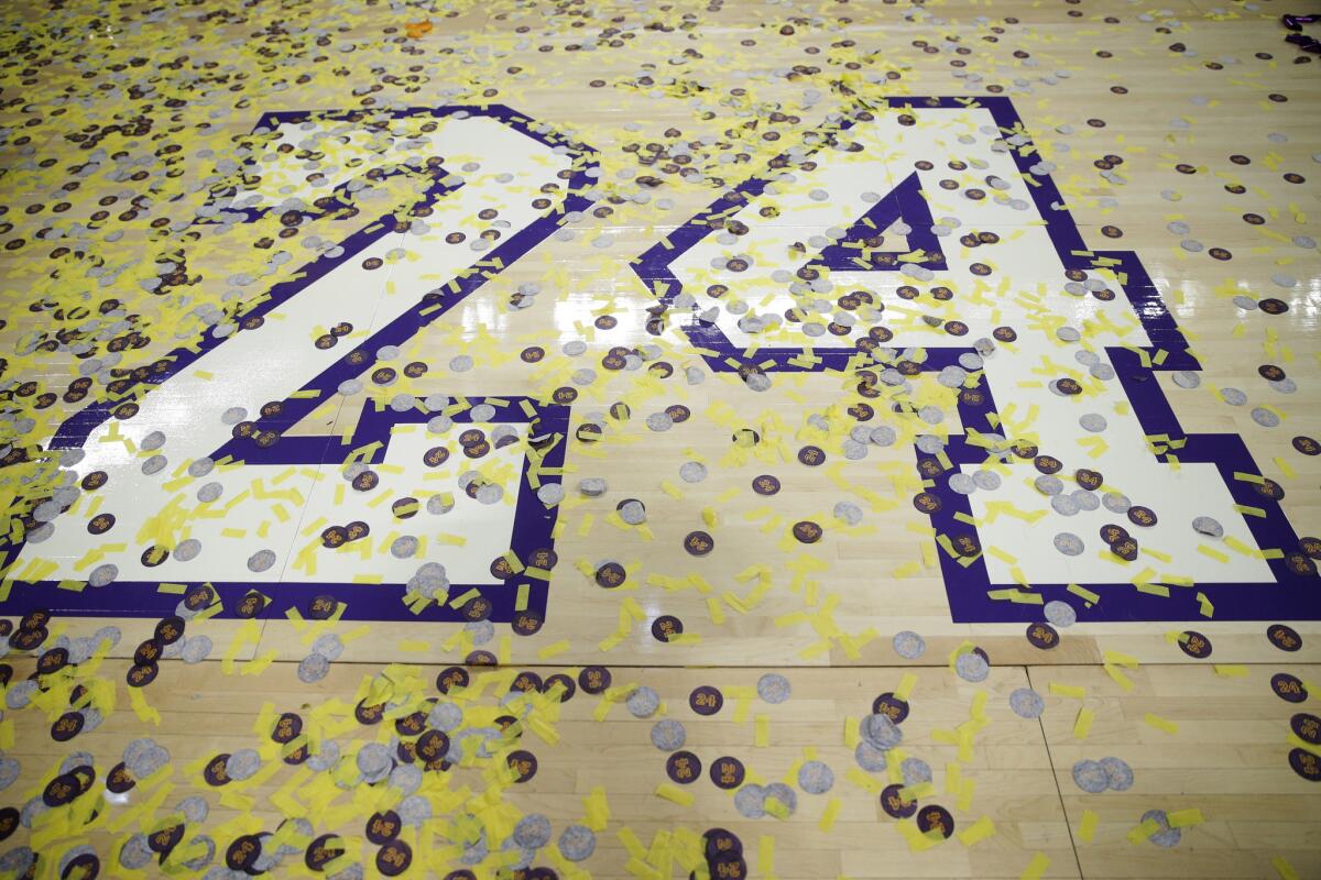 Confetti covers Los Angeles Lakers' Kobe Bryant's number on the court after the last NBA basketball game of Bryant's career against the Utah Jazz, Wednesday, April 13, 2016, in Los Angeles. (AP Photo/Jae C. Hong)