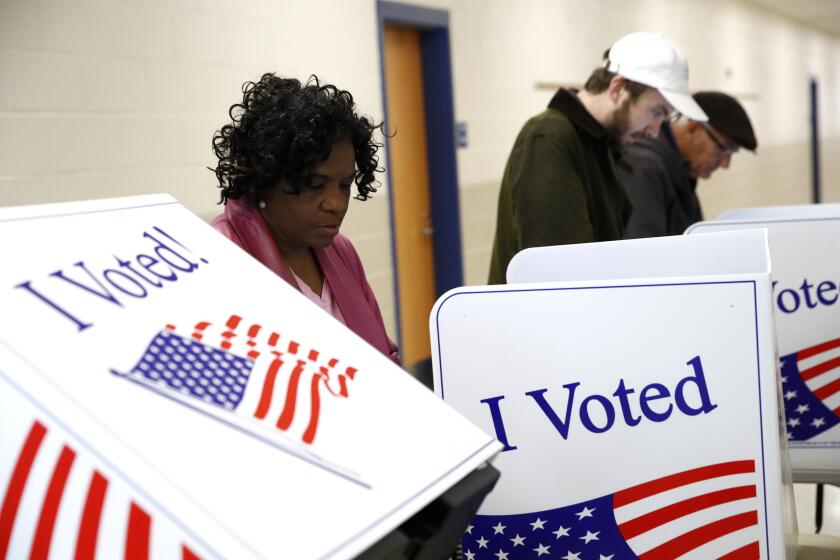 FILE - Voters fill out their ballots at a polling place, Feb. 29, 2020, in Charleston, S.C. A federal court ruled Thursday, March 28, 2024, that this year's congressional elections in South Carolina will be held under a map that it had already deemed unconstitutional and discriminatory against Black voters, with time running out ahead of voting deadlines, and the lack of a decision by the Supreme Court. (AP Photo/Patrick Semansky, File)