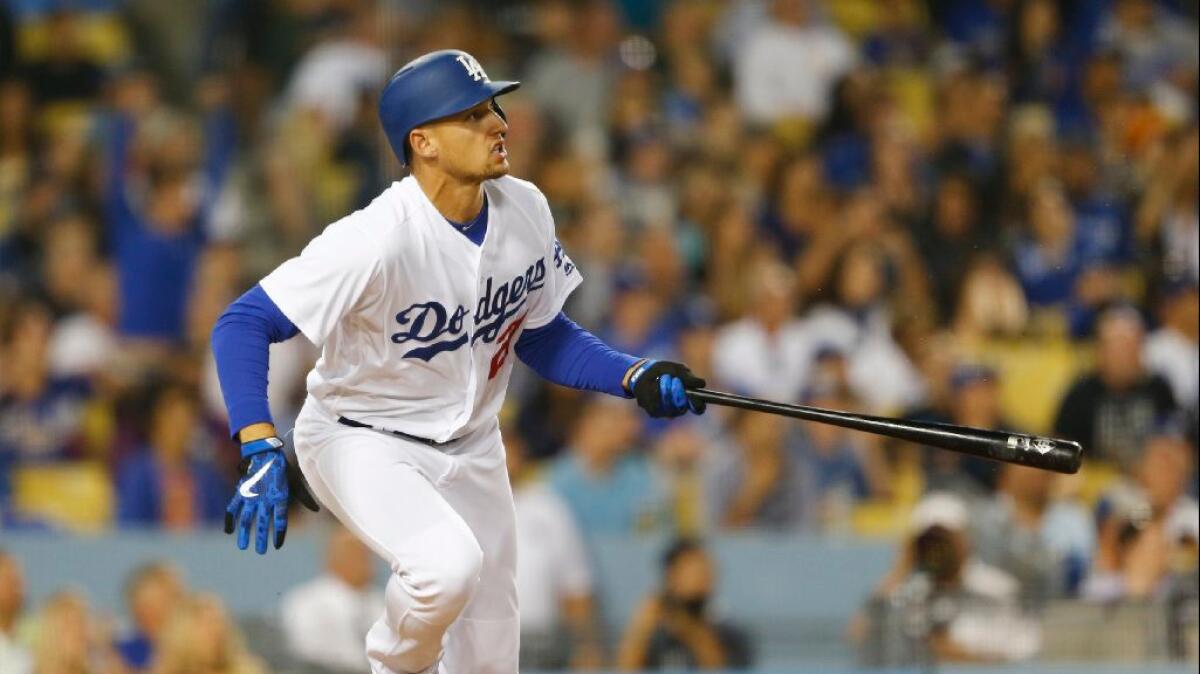 Dodgers outfielder Trayce Thompson watches his three-run home run clear the fence during a game against the Brewers on June 16.