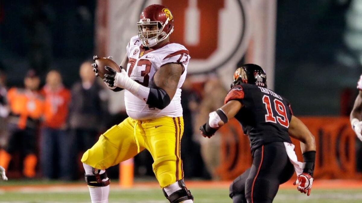 USC offensive tackle Zach Banner catches a lateral on the final play of the Trojans' loss to Utah, 31-27, on Sept. 23.
