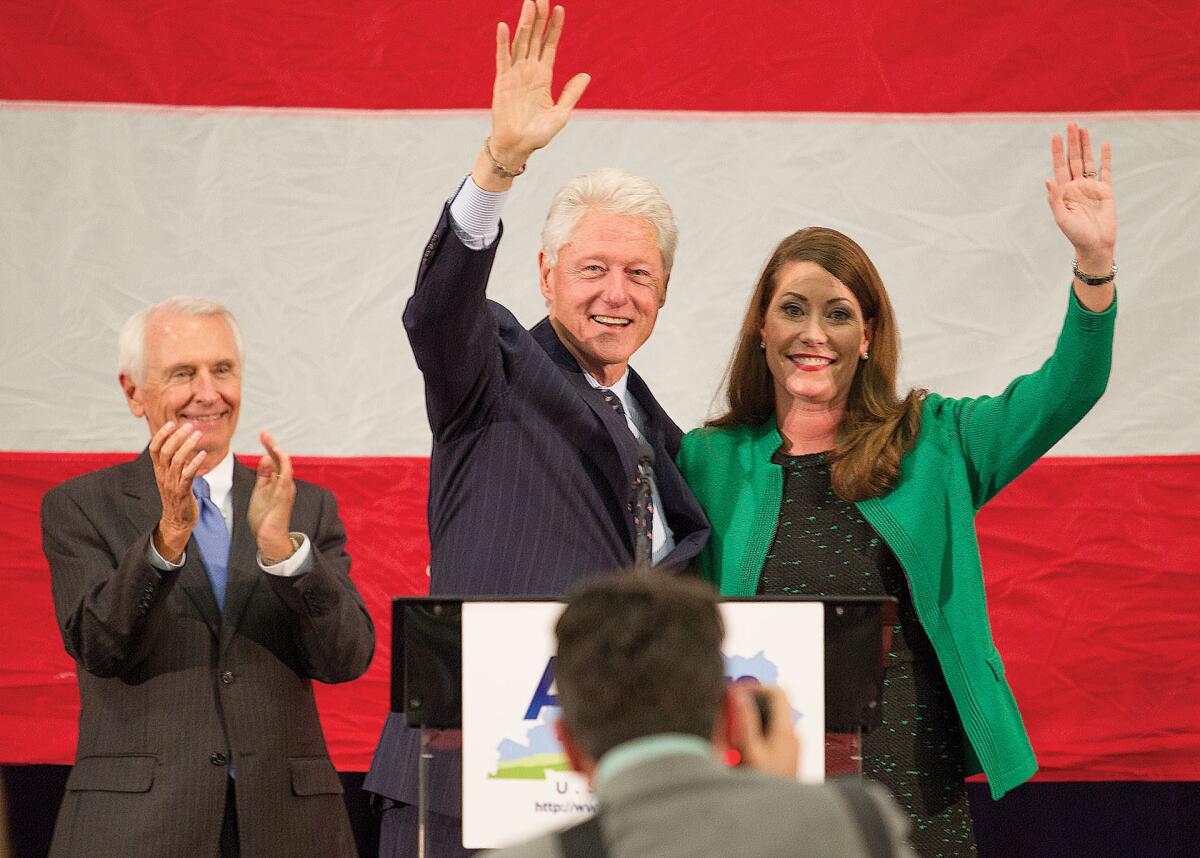 Kentucky Gov. Steve Beshear, former President Clinton and Democratic Senate candidate Allison Lundergan Grimes rally voters in Paducah on Oct. 21.