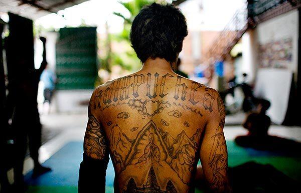 A tattoo on Tuy "K.K." Sobil spells "Kampuchea," former name of Cambodia. Other images on his back depict the temples of Angkor Wat.