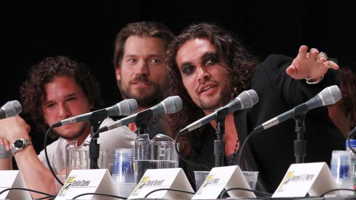 Jason Momoa, right, with Kit Harington, left, and Nikolaj Coster-Waldau at Comic-Con International San Diego in 2011.