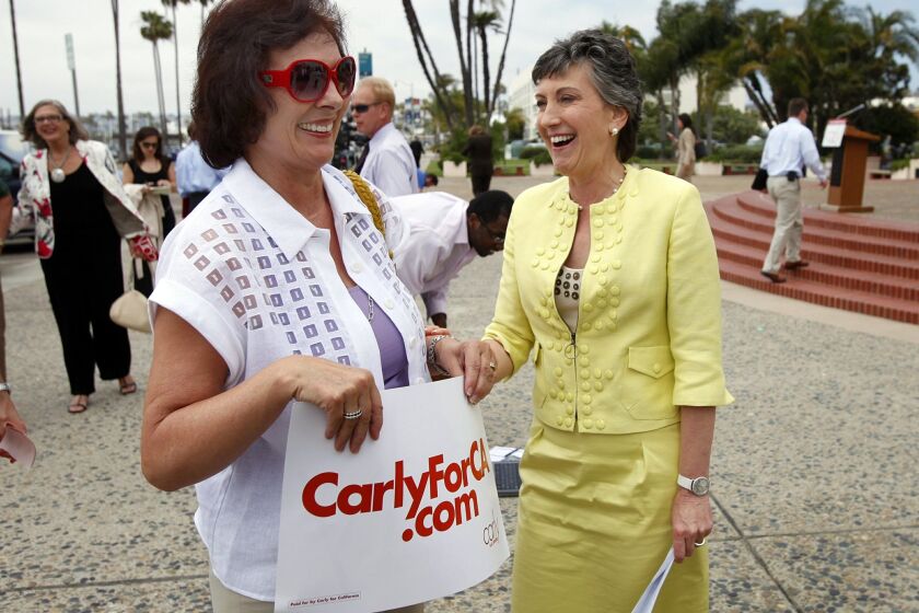 Republican U.S. Senate candidate Carly Fiorina (right) laughs with supporter Ursula Kuster during a visit to San Diego on Monday, as candidates made last-minute appeals for votes.