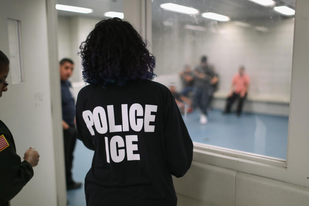 Undocumented immigrants wait in a holding cell at a U.S. Immigration and Customs Enforcement facility in New York in April 2018.