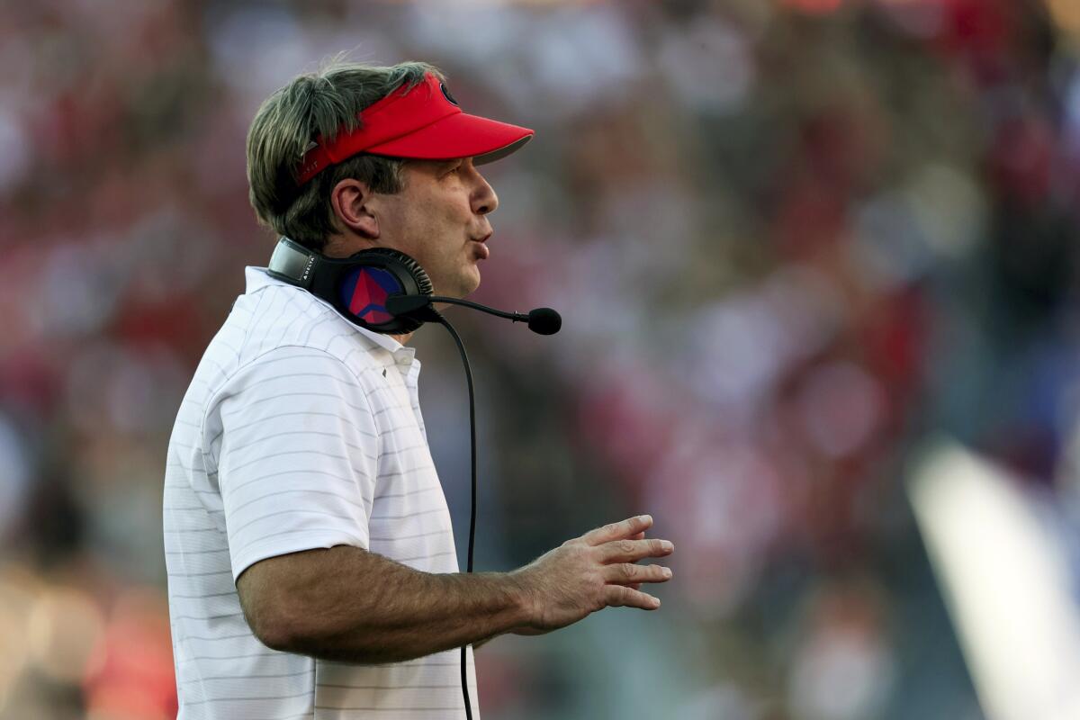 Georgia head coach Kirby Smart signals to players during the first half of an NCAA college football game against Kentucky, Saturday, Oct. 16, 2021, in Athens, Ga. (AP Photo/Butch Dill)