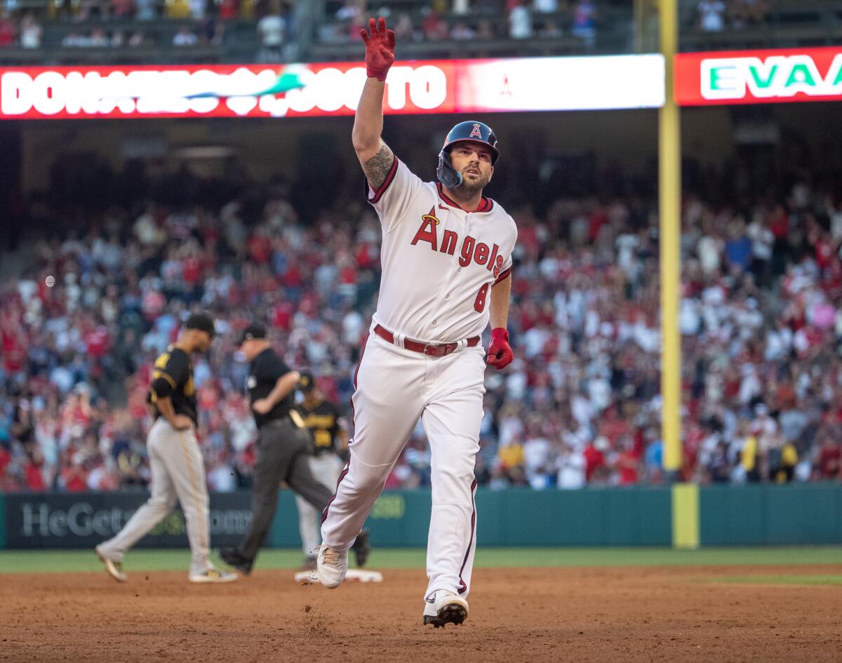 Angels third baseman Mike Moustakas celebrates a home run against the Pittsburgh Pirates on July 21, 2023,  in Anaheim.