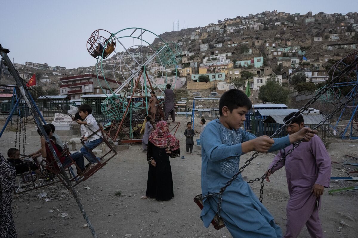 Children play at a park in Kabul, Afghanistan, Friday, Sept. 10, 2021. (AP Photo/Bernat Armangue)