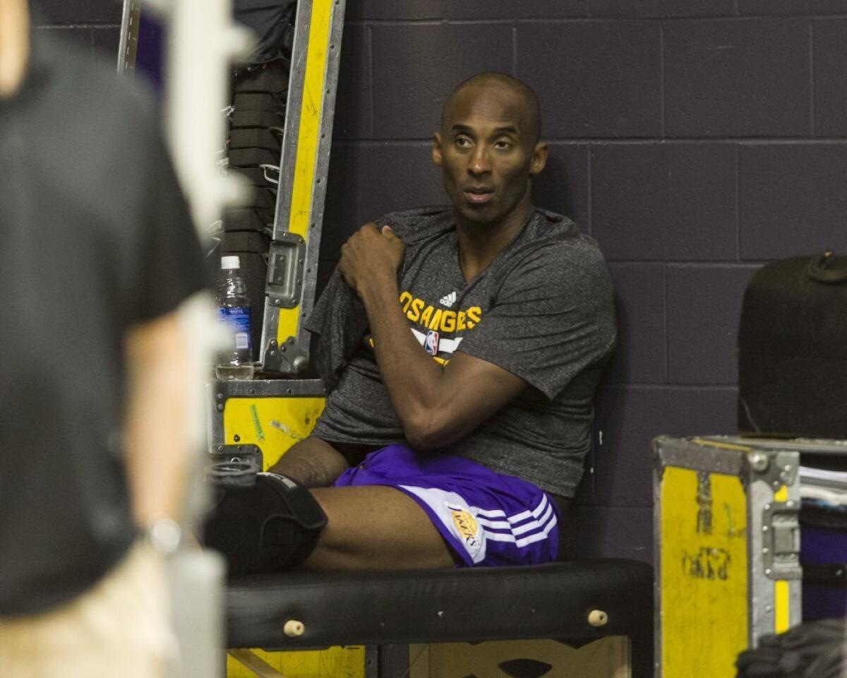 Kobe Bryant wears an ice pack on his shoulder during team practice at the Stan Sheriff Center on Tuesday in Honolulu.