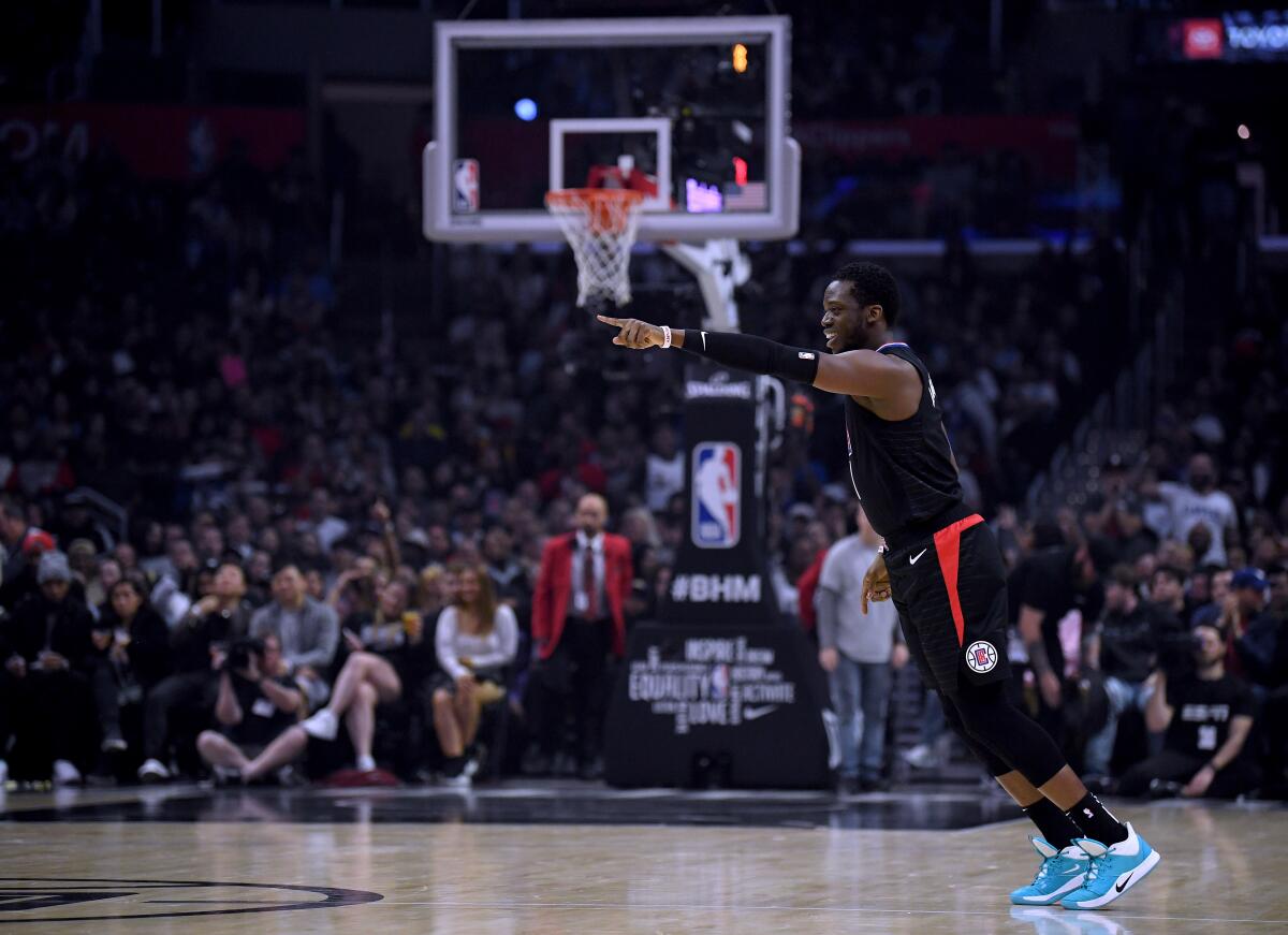 Clippers guard Reggie Jackson celebrates after making a three-pointer against the Denver Nuggets on Feb. 28.