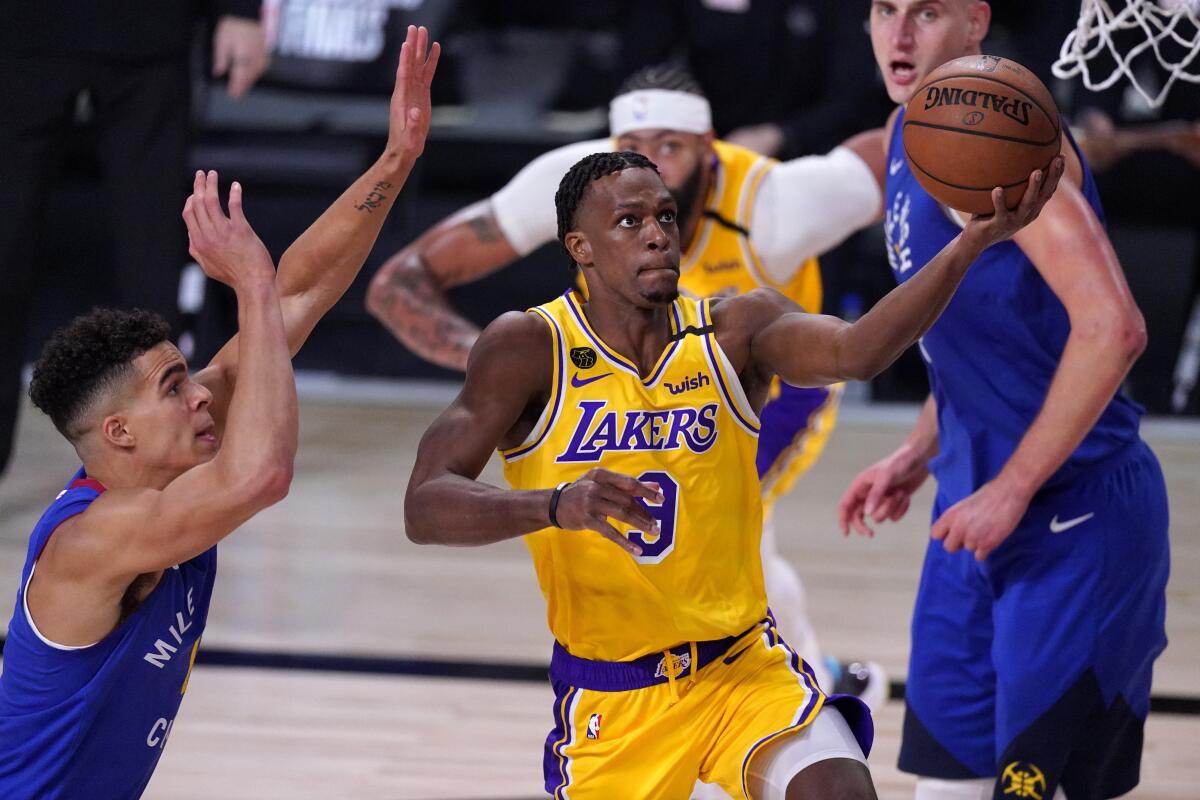 Lakers guard Rajon Rondo drives down the lane for a layup against the Nuggets during a Game 1 win on Sept. 18, 2020.