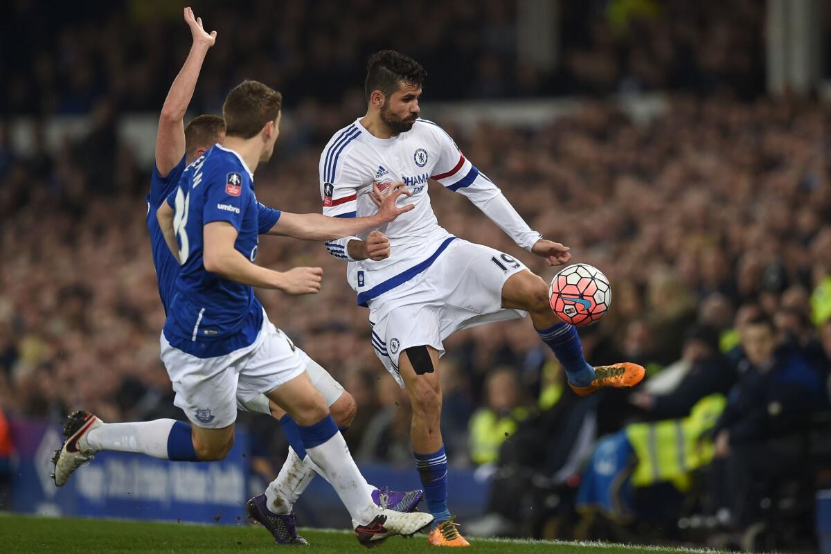 Chelsea's Diego Costa vies with Everton's James McCarthy, left, and Seamus Coleman on March 12.