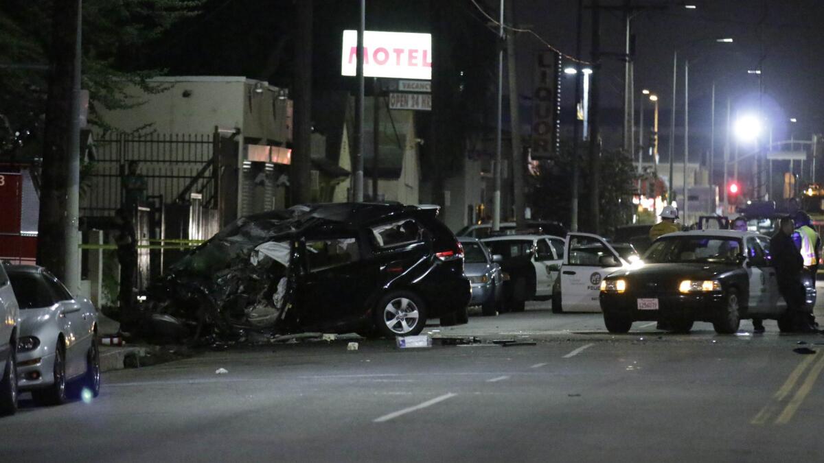 A van collided with a Los Angeles Fire Department truck near the intersection of 84th and Main streets in Los Angeles after a police pursuit on Wednesday night.
