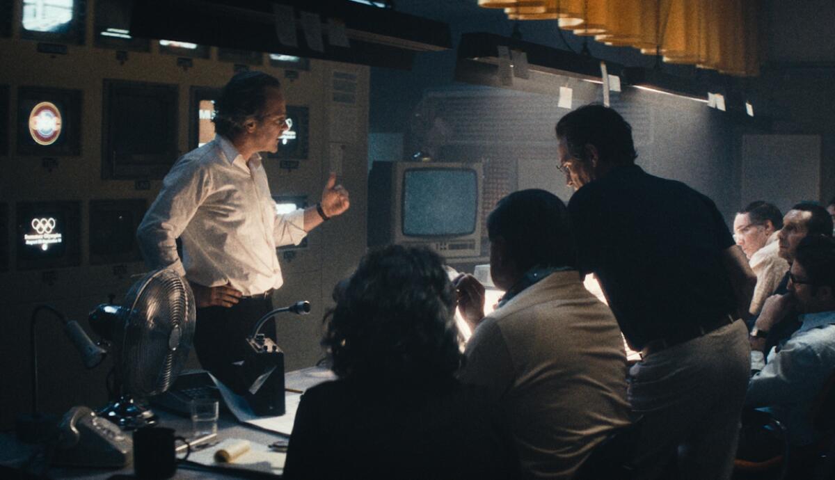 A man runs a television control room.