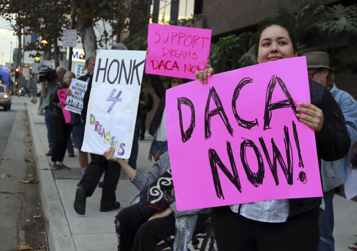 Demonstrators urge protections for Deferred Action for Childhood Arrivals program (DACA) recipients outside the office of California Democratic Sen. Dianne Feinstein last week.