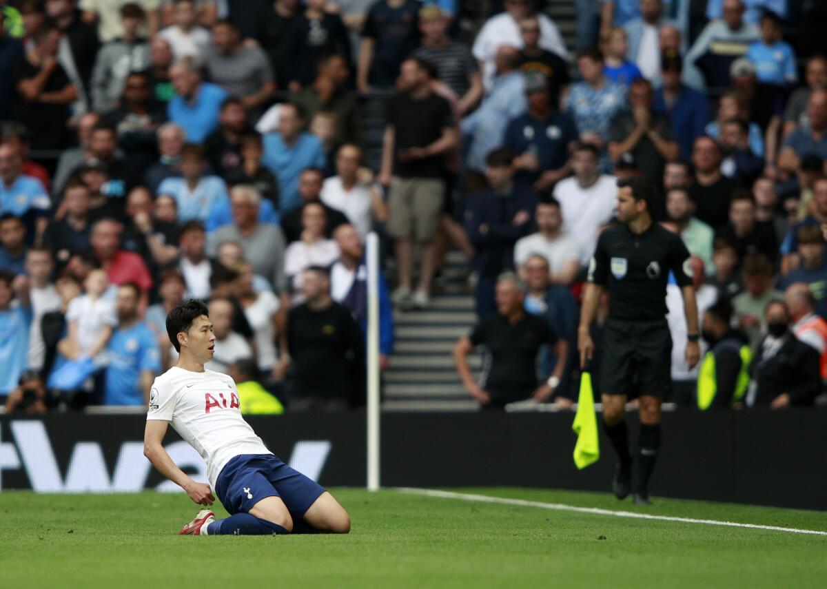 Tottenham's Son Heung-min celebrates after scoring his side's opening goal during the English Premier League soccer match between Tottenham Hotspur and Manchester City at the Tottenham Hotspur Stadium in London, Sunday, Aug. 15, 2021. (AP Photo/Ian Walton)
