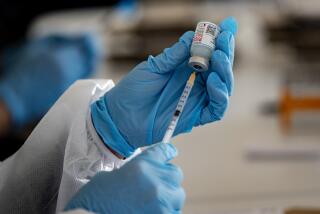 RIVERSIDE, CA - FEBRUARY 2, 2021: A health care professional measures a dose of the Moderna vaccine at a vaccination site in the parking lot of the Riverside Convention Center on February 2, 2021 in Riverside, California. Currently, this site is capable of giving 500 vaccinations a day in one of the regions hardest hit by the pandemic. Only residents 65 and older and educators are eligible for the vaccination here.(Gina Ferazzi / Los Angeles Times)