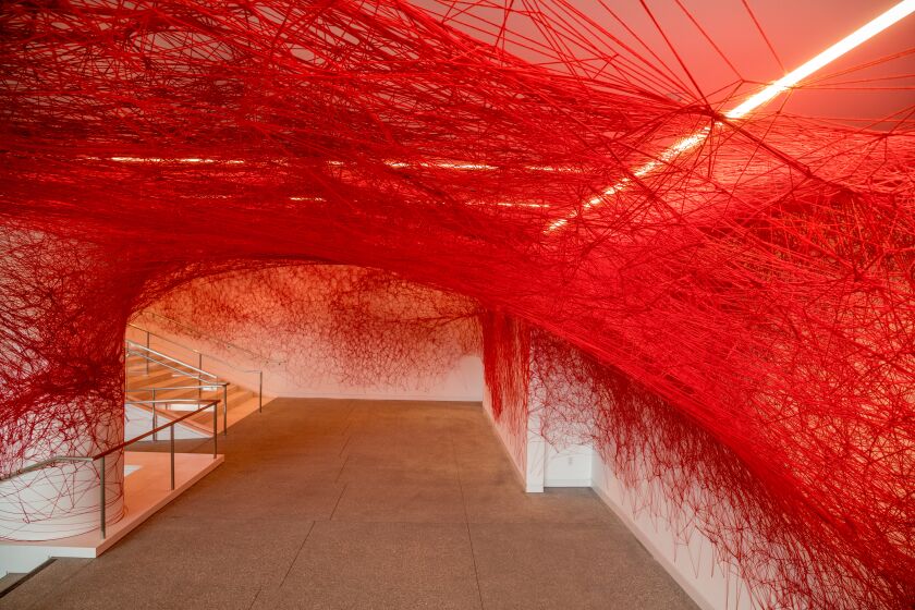 LOS ANGELES, CA - MARCH 23, 2023 - Artist Chiharu Shiota installation, The Network, made with red yarn is on display. In the new lobby are at the Hammer Museum, March 23, Los Angeles, CA . (Ricardo DeAratanha / Los Angeles Times)