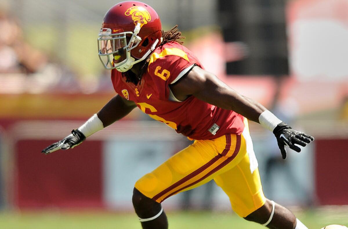 USC safety Josh Shaw celebrates his tackle of Boston College's David Dudeck during a game earlier this season.