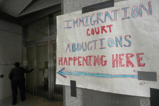 A sign posted outside the San Francisco Immigration Court in October protests enforcement actions by immigration agents.