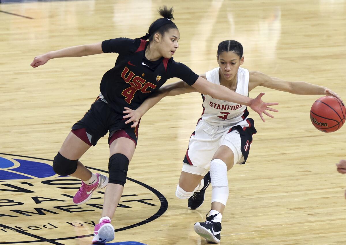 Stanford guard Anna Wilson drives as USC guard Endyia Rogers defends.
