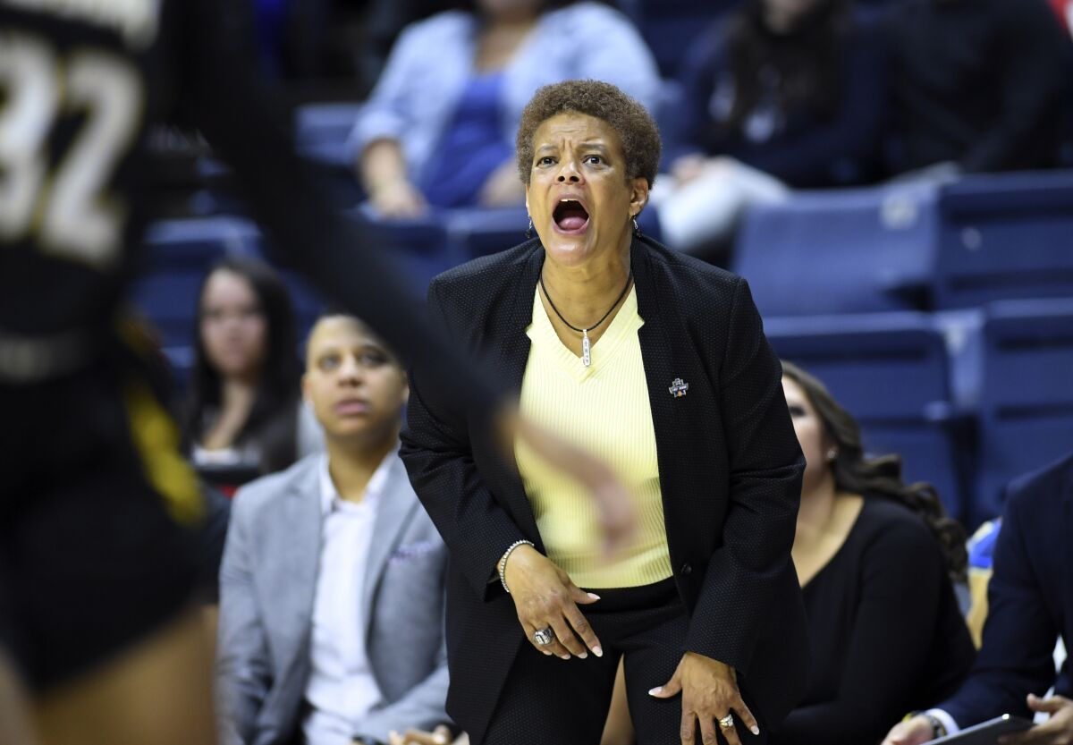 FILE - Towson head coach Diane Richardson yells instructions to her team during a first-round women's college basketball game against Connecticut in the NCAA Tournament, on March 22, 2019, in Storrs, Conn. Richardson, who led Towson to its first NCAA Tournament appearance in school history, was named Temple University’s women’s basketball head coach, the school announced Tuesday, April 5, 2022. (AP Photo/Stephen Dunn, File)