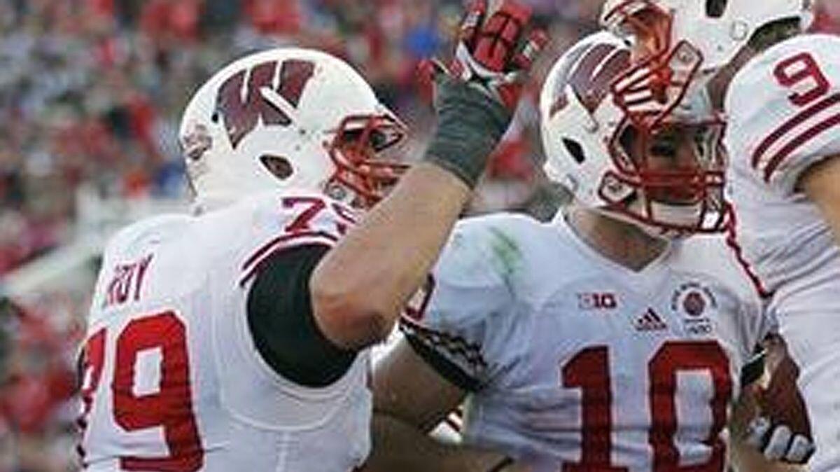 Wisconsin offensive lineman Ryan Groy, left, celebrates with teammates during the Rose Bowl game against Stanford on Jan. 1, 2013.