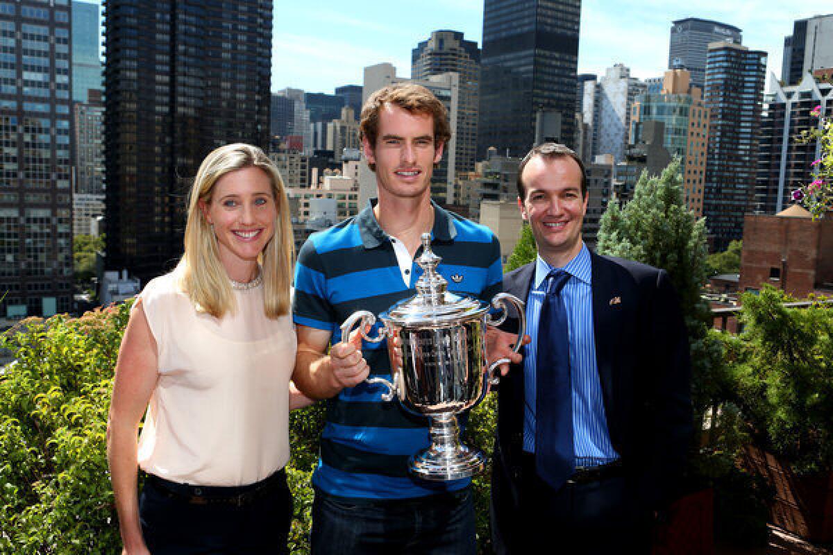 Andy Murray with the U.S. Open Championship trophy next to the British Consul-General Danny Lopez and his wife, Susan Grieve, during his New York City trophy tour Tuesday.