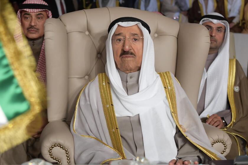 FILE - In this March 31, 2019 file photo, Kuwait's ruling emir, Sheikh Sabah Al Ahmad Al Sabah, attends the opening of the 30th Arab Summit, in Tunis, Tunisia. Kuwait said its 91-year-old ruling emir, who recently underwent surgery, will travel to the U.S. on Thursday for further medical care. That’s according to a report late Wednesday, July 22, 2020, by the state-run KUNA news agency. Sheikh Sabah’s sudden surgery could inspire a renewed power struggle within Kuwait’s ruling family. (Fethi Belaid/Pool Photo via AP, File)