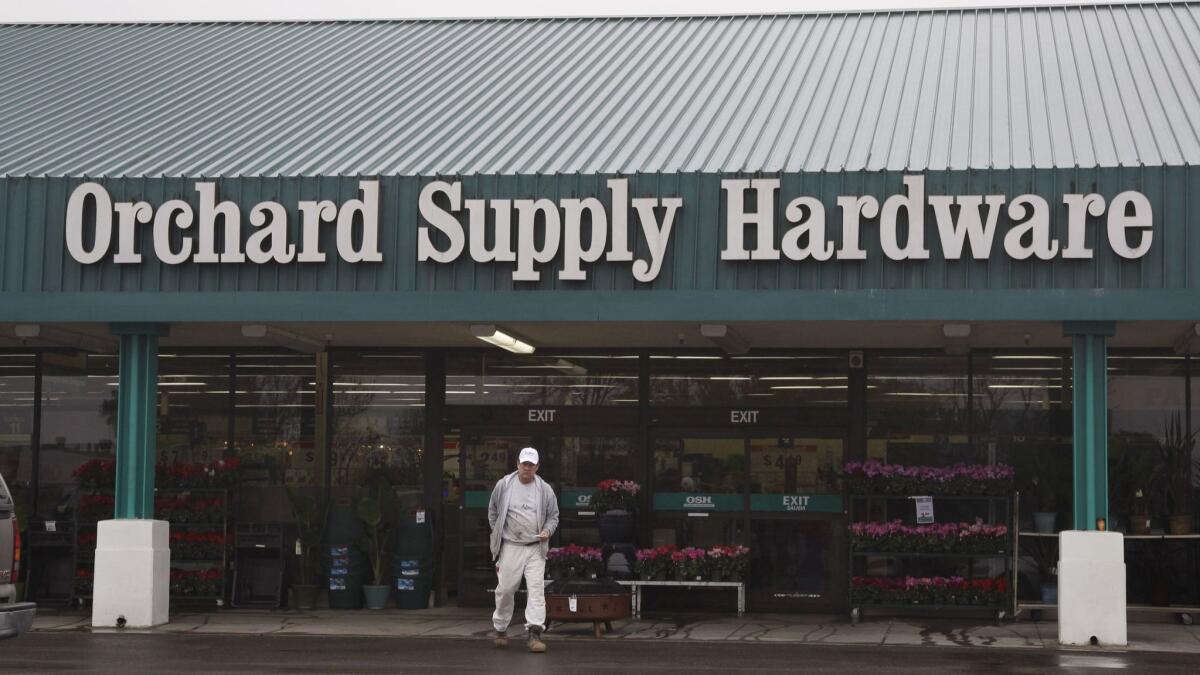A customer leaves an Orchard Supply Hardware store in Mountain View, Calif., in January 2012.