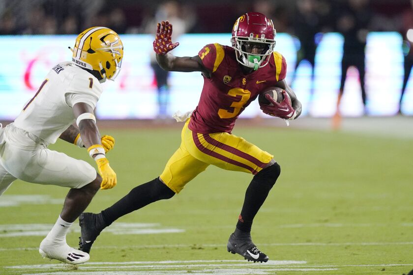 Southern California wide receiver Jordan Addison, right, tries to fend off Arizona State defensive back Jordan Clark during the second half of an NCAA college football game Saturday, Oct. 1, 2022, in Los Angeles. (AP Photo/Mark J. Terrill)
