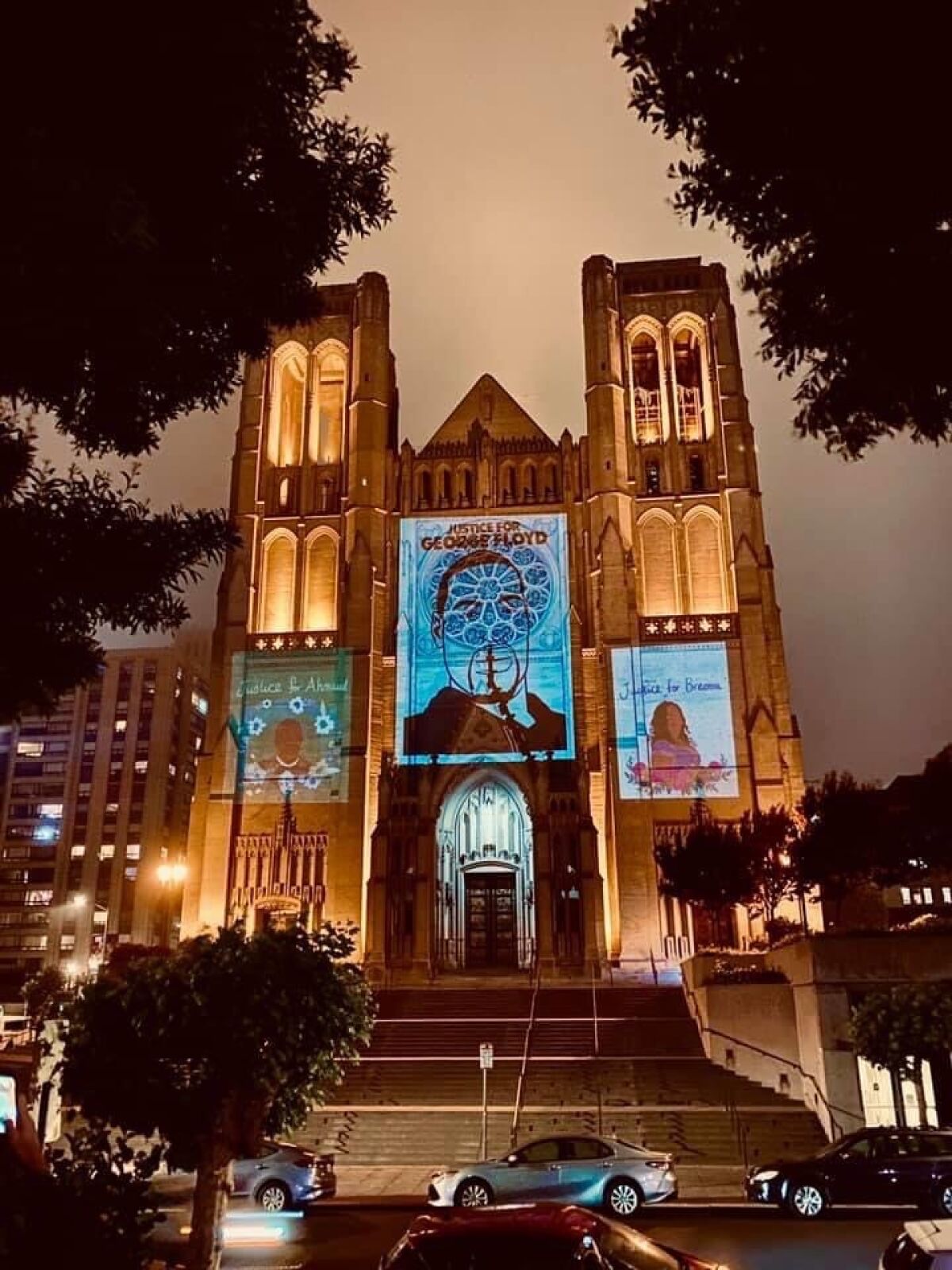 Designs of George Floyd, Ahmaud Arbery and Breonna Taylor projected onto the Grace Cathedral in San Francisco