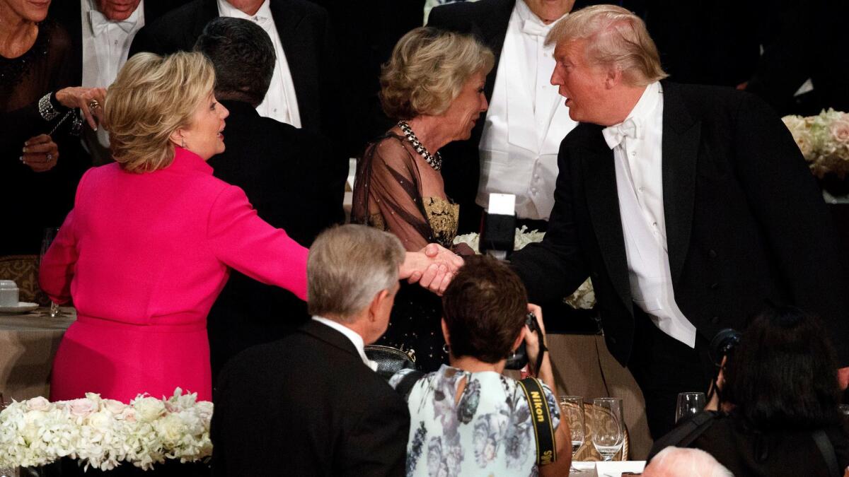 Hillary Clinton and Donald Trump shake hands during the Alfred E. Smith Memorial Foundation dinner on Oct. 20 in New York.