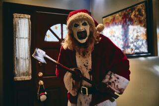 A clown in a Santa outfit terrorizes a home with an ax.