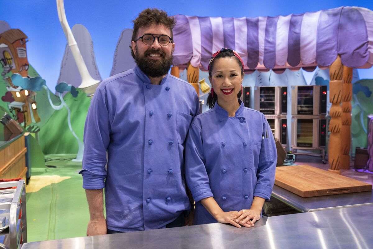 Carlsbad resident Huiwen Lu, right, with her baking teammate Kyle Smothers on the "Dr. Seuss Baking Challenge."