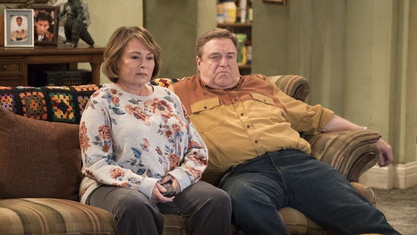 Roseanne Barr, left, and John Goodman appear in a scene from the reboot of "Roseanne," which pulled in 18.2 million viewers for its premiere.