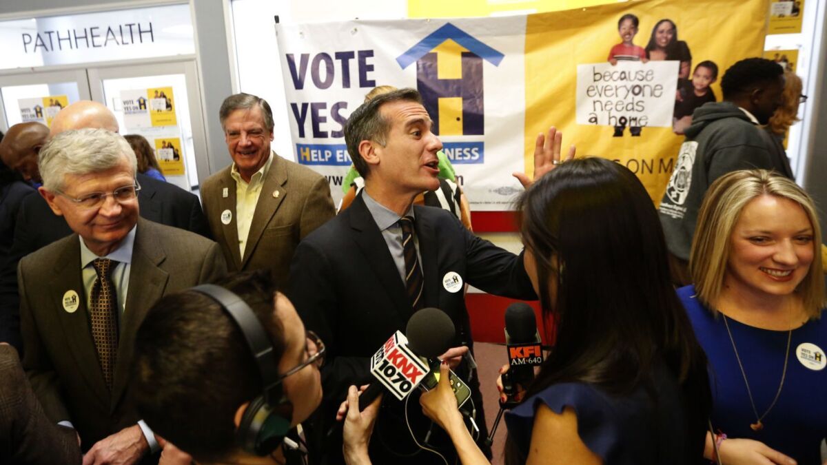 Los Angeles Mayor Eric Garcetti, center, at a Measure H kickoff event in 2017. The state Fair Political Practices Commission is examining whether L.A. County violated campaign law in promoting the tax measure last year.