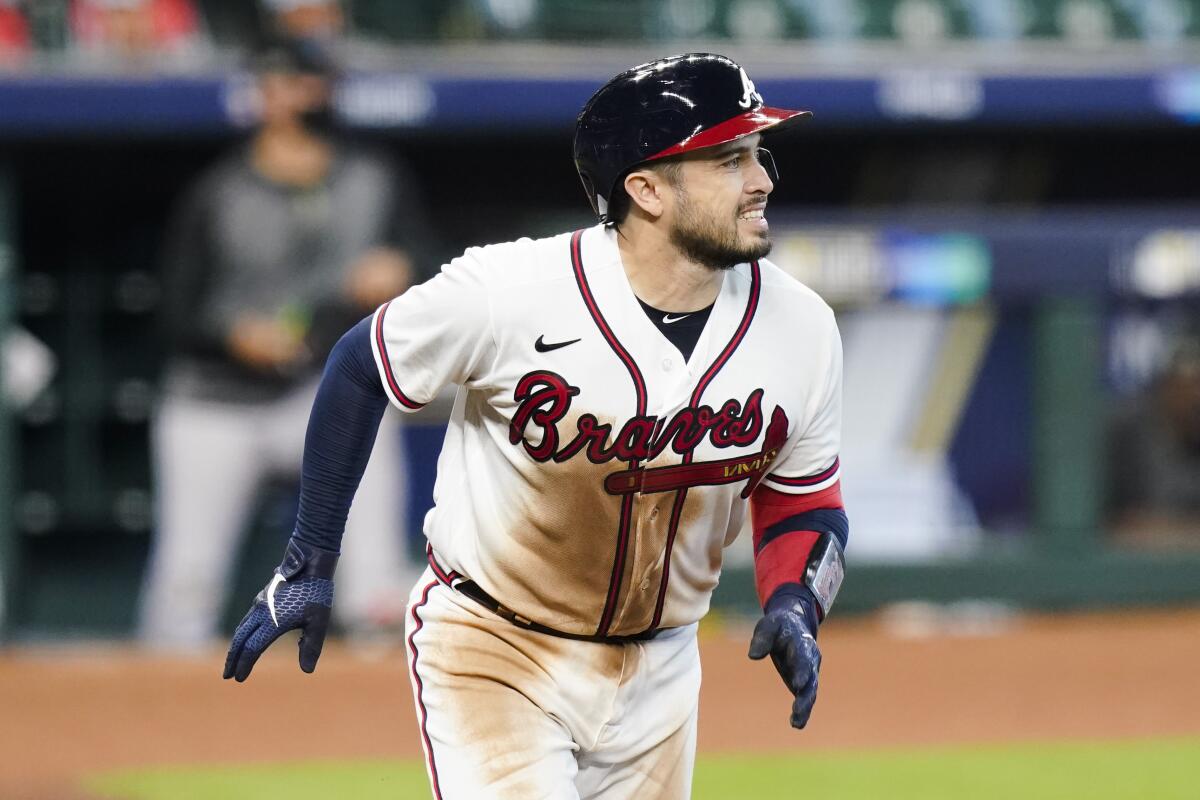 Atlanta Braves catcher Travis d'Arnaud hits a three-run home run against the Miami Marlins in Game 1 of the NLDS on Oct. 6.