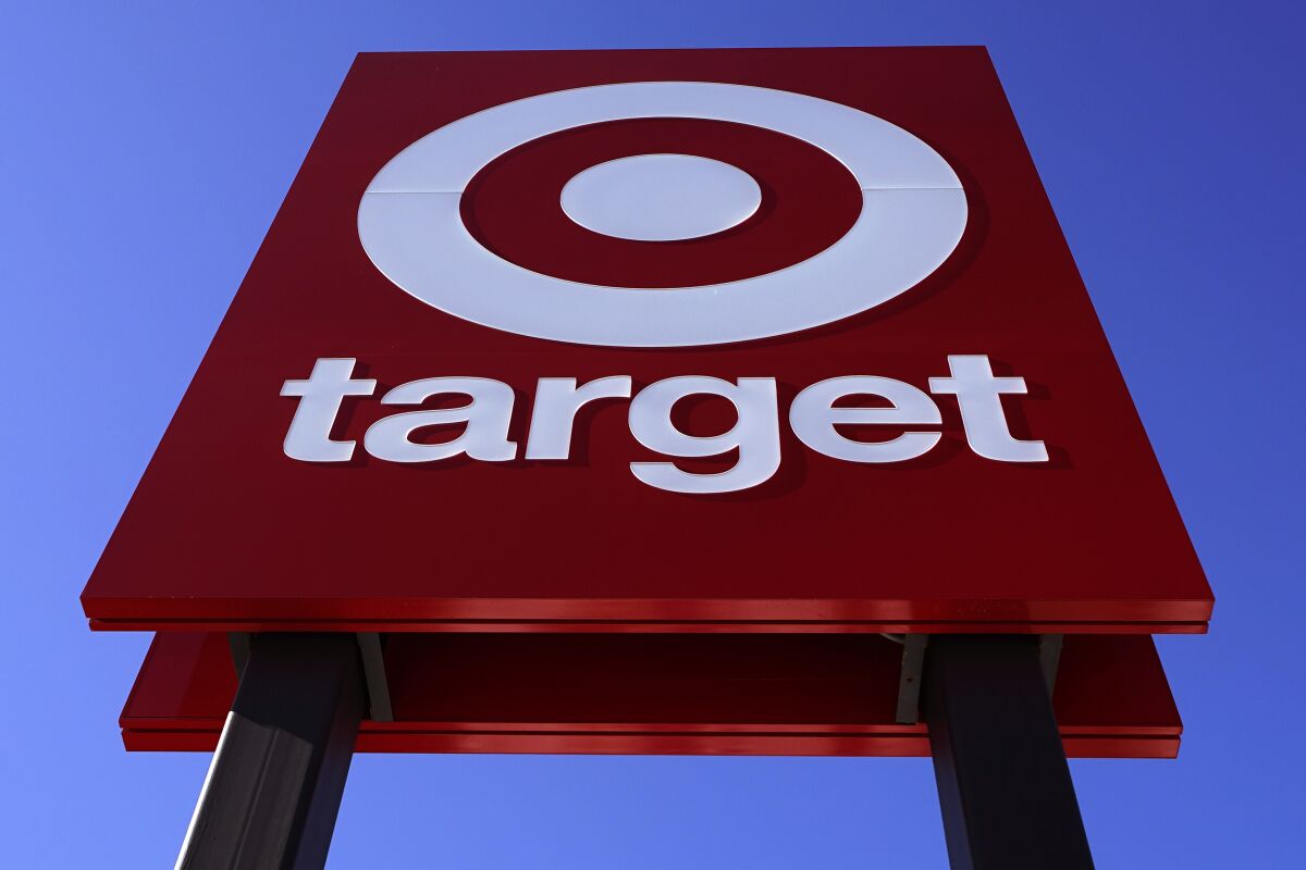 FILE - The bullseye logo on a sign outside a Target store is seen, Monday, Feb. 28, 2022. Workers at a Target store in Christiansburg, Virginia, filed paperwork Tuesday, May 10, 2022, with federal labor regulators to hold a union election, joining a wave of union organizing at other retailers around the country. (AP Photo/Charles Krupa, File)