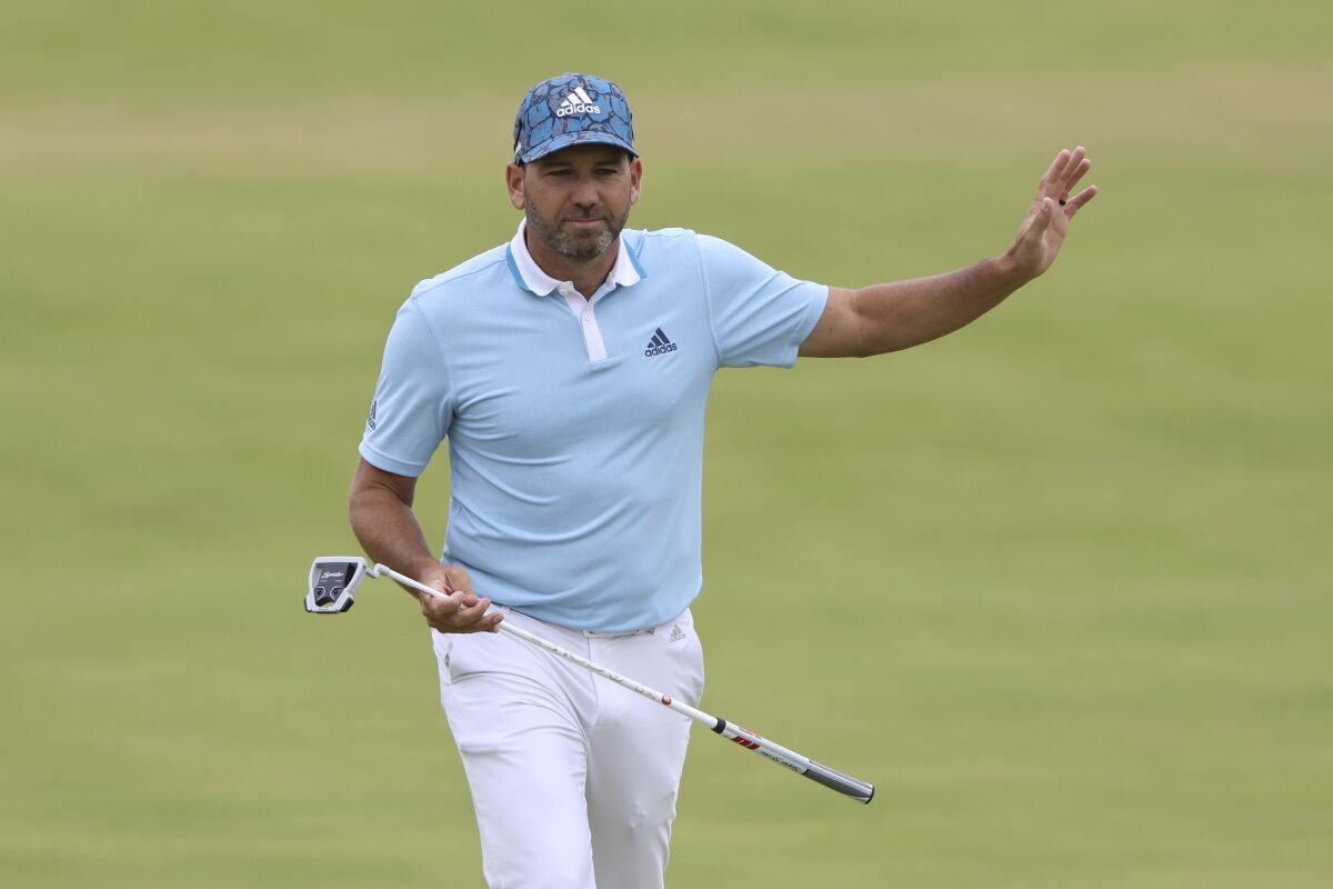 Spain's Sergio Garcia acknowledges the crowd as he walks onto the 18th green during the first round British Open Golf Championship at Royal St George's golf course Sandwich, England, Thursday, July 15, 2021. (AP Photo/Ian Walton)