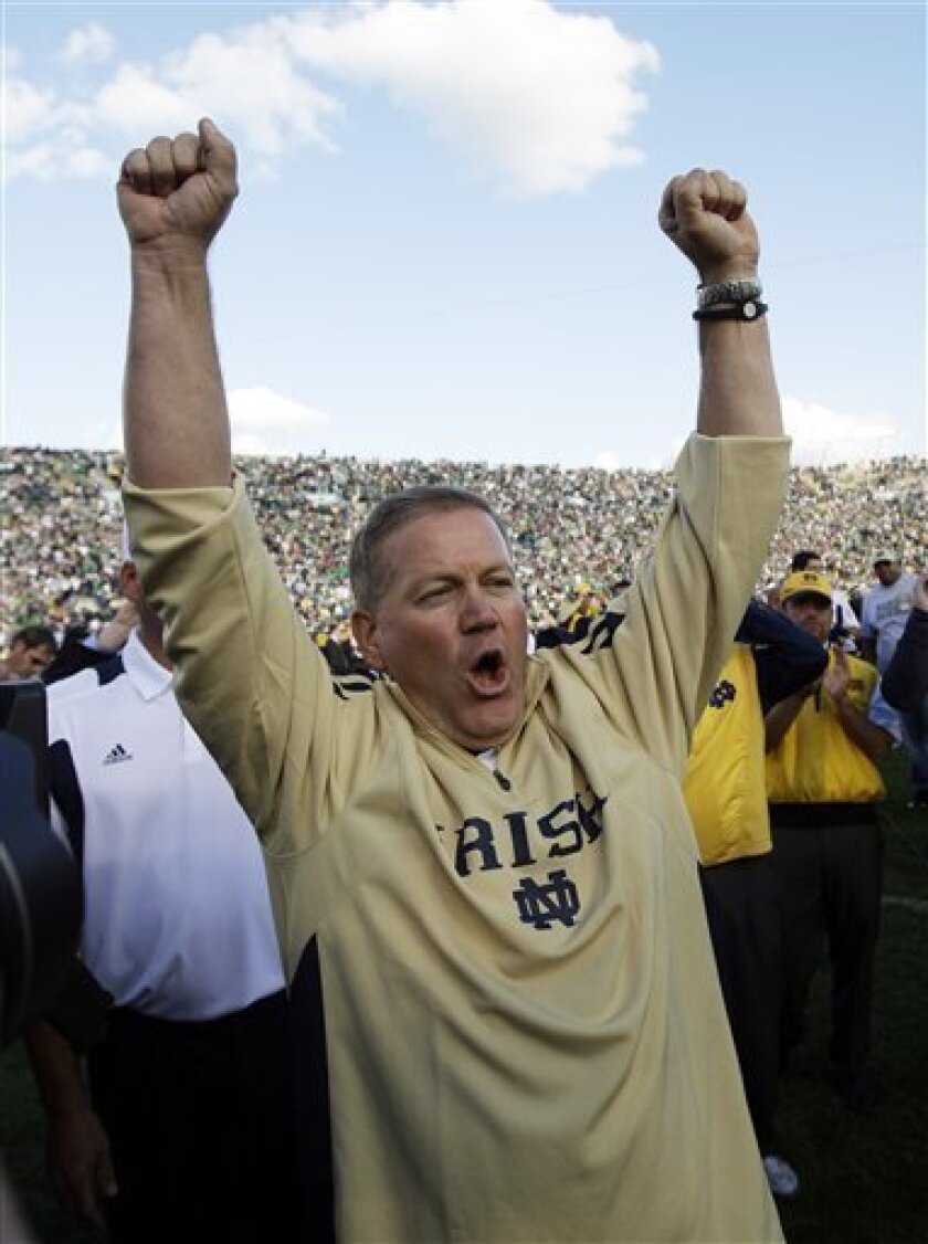 Notre Dame coach Brian Kelly celebrates after Notre Dame defeated Purdue 23-12 in an NCAA college football game in South Bend, Ind., Saturday, Sept. 4, 2010. (AP Photo/Darron Cummings)