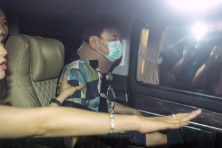 Former Thai Prime Minister Thaksin Shinawatra, center, sits in a vehicle with his daughters Paetongtarn and Pinthongta after being released on parole Sunday, Feb. 18, 2024, in Bangkok, Thailand. Thaksin was released from Police General Hospital where for the last six months he had been serving time for corruption-related offenses. (AP Photo/Sakchai Lalit)