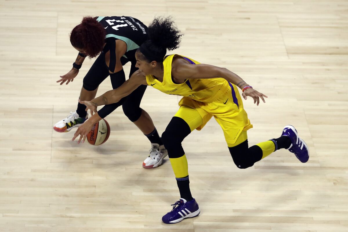 Sparks forward Candace Parker steals the ball from New York Liberty center Amanda Zahui B. on Aug. 11 in Bradenton, Fla.