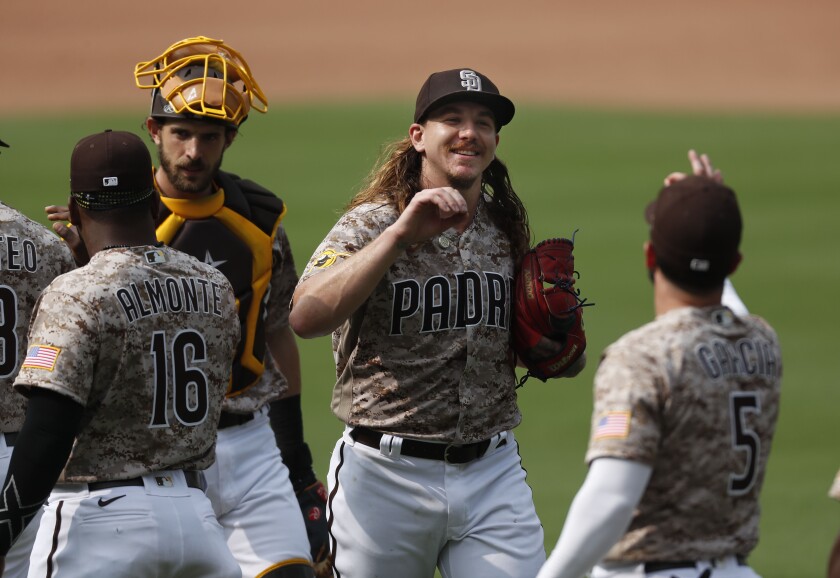 Padres starter Mike Clevinger celebrates win against the San Francisco Giants on Sunday at Petco Park.